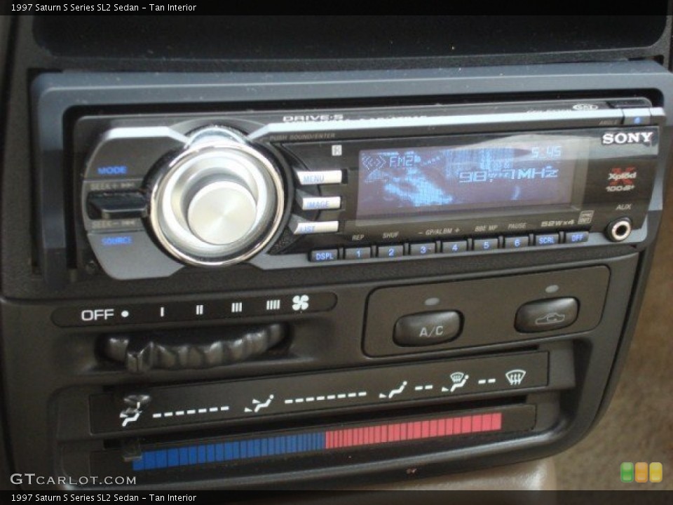 Tan Interior Audio System for the 1997 Saturn S Series SL2 Sedan #53640645