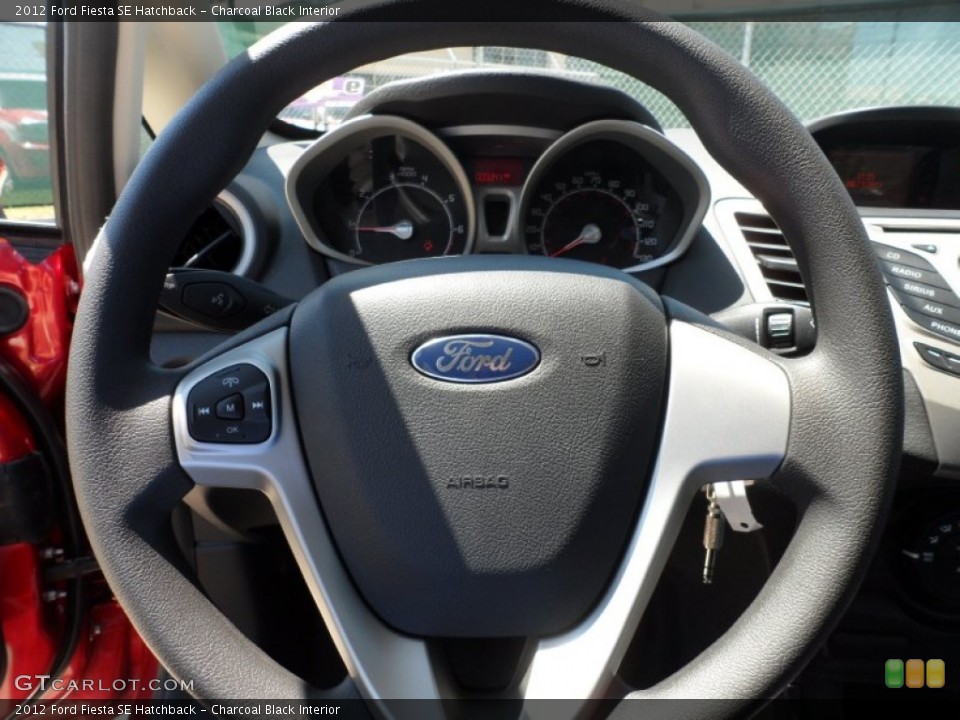 Charcoal Black Interior Steering Wheel for the 2012 Ford Fiesta SE Hatchback #53654802