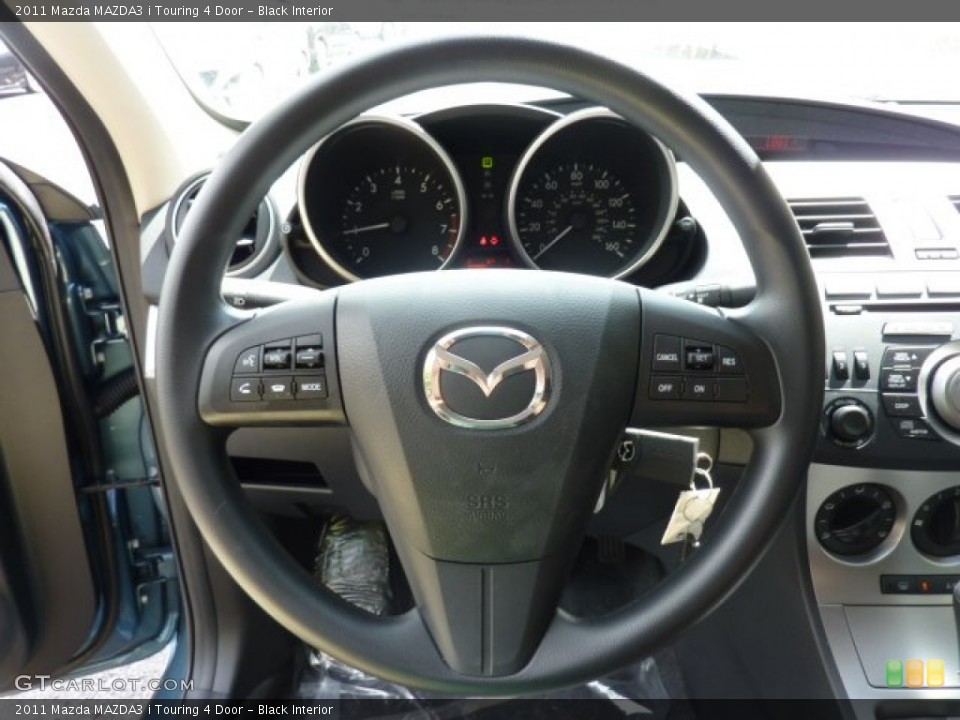 Black Interior Steering Wheel for the 2011 Mazda MAZDA3 i Touring 4 Door #53655098