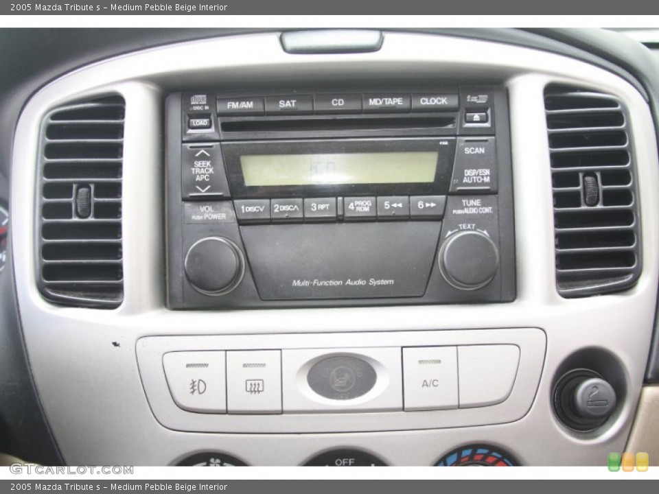 Medium Pebble Beige Interior Controls for the 2005 Mazda Tribute s #53719430