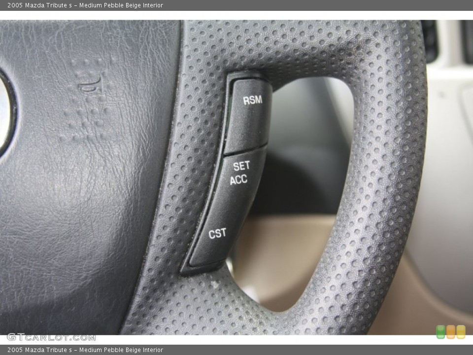 Medium Pebble Beige Interior Controls for the 2005 Mazda Tribute s #53719441