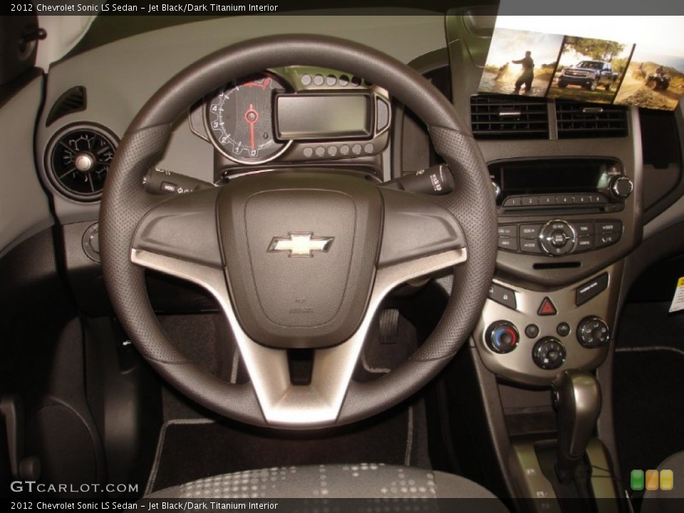 Jet Black/Dark Titanium Interior Steering Wheel for the 2012 Chevrolet Sonic LS Sedan #53853561