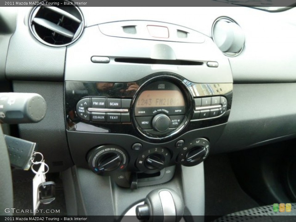 Black Interior Controls for the 2011 Mazda MAZDA2 Touring #53937667