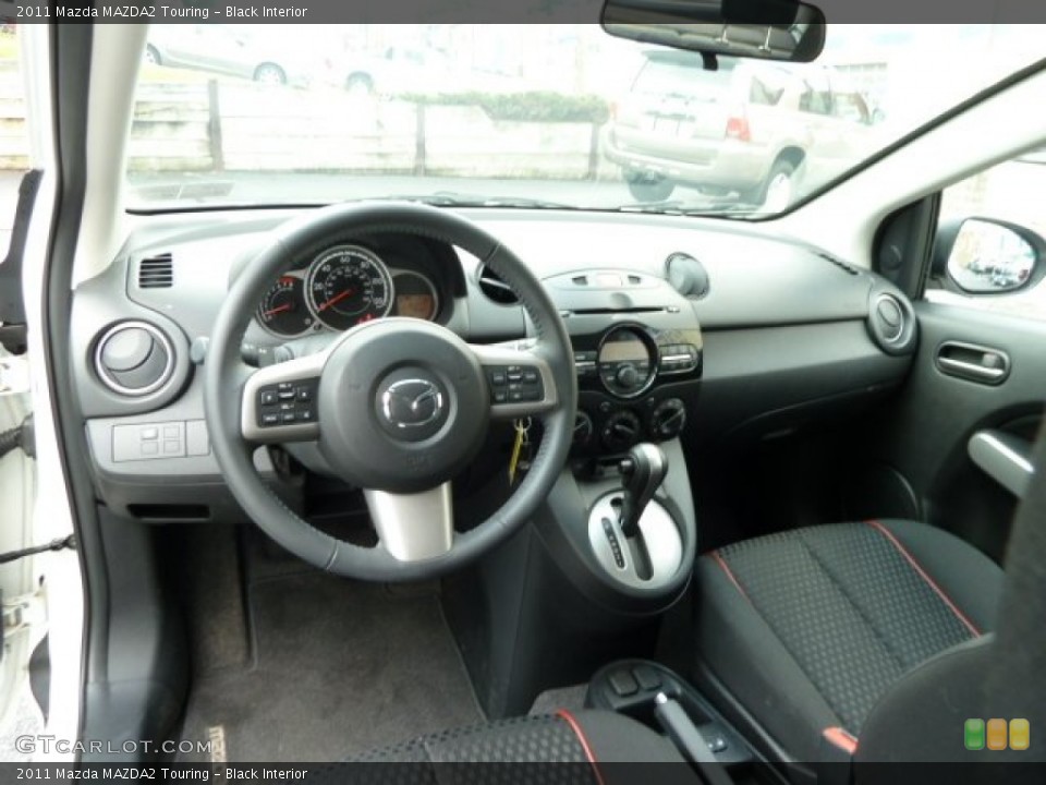 Black Interior Dashboard for the 2011 Mazda MAZDA2 Touring #53937703