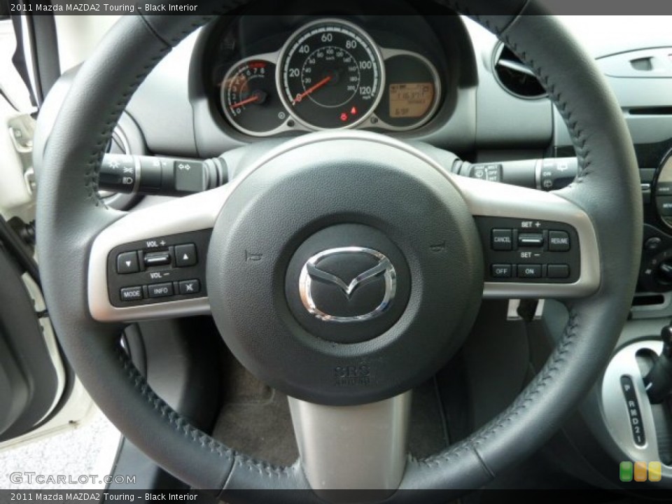 Black Interior Steering Wheel for the 2011 Mazda MAZDA2 Touring #53937741