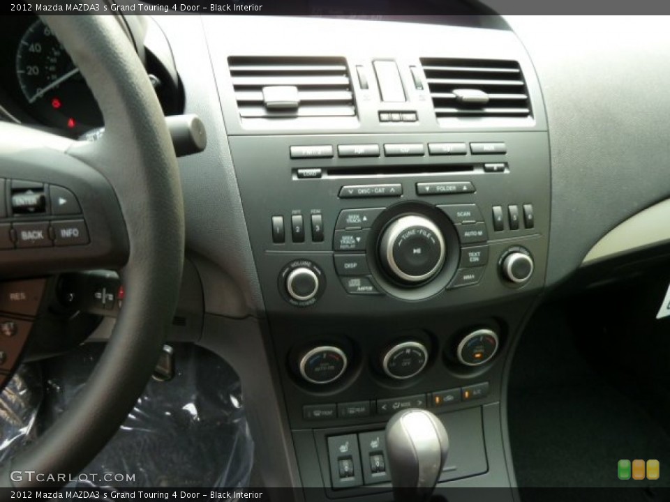 Black Interior Controls for the 2012 Mazda MAZDA3 s Grand Touring 4 Door #53970345