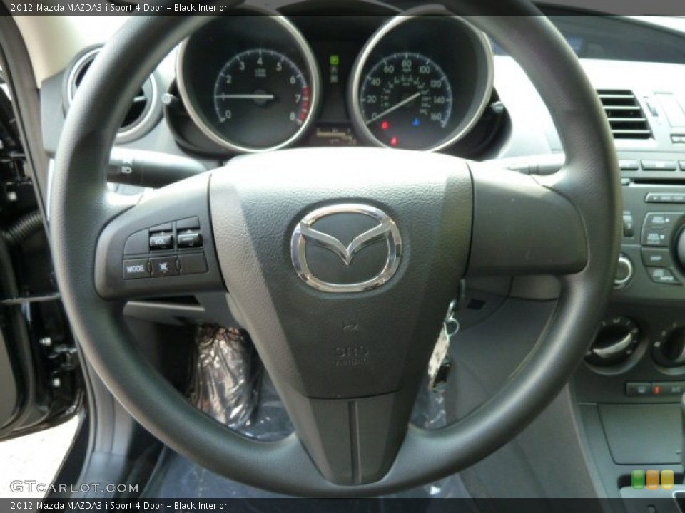 Black Interior Steering Wheel for the 2012 Mazda MAZDA3 i Sport 4 Door #53971050