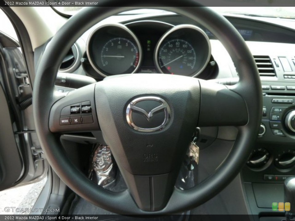 Black Interior Steering Wheel for the 2012 Mazda MAZDA3 i Sport 4 Door #53971425