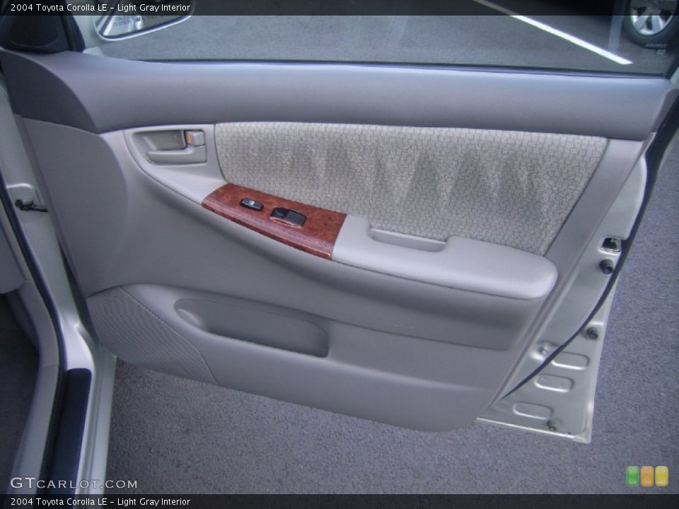 Light Gray Interior Door Panel for the 2004 Toyota Corolla LE #53999473
