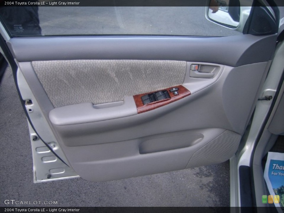 Light Gray Interior Door Panel for the 2004 Toyota Corolla LE #53999492