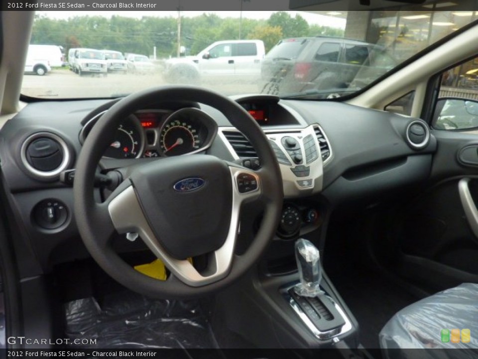 Charcoal Black Interior Dashboard for the 2012 Ford Fiesta SE Sedan #54081339