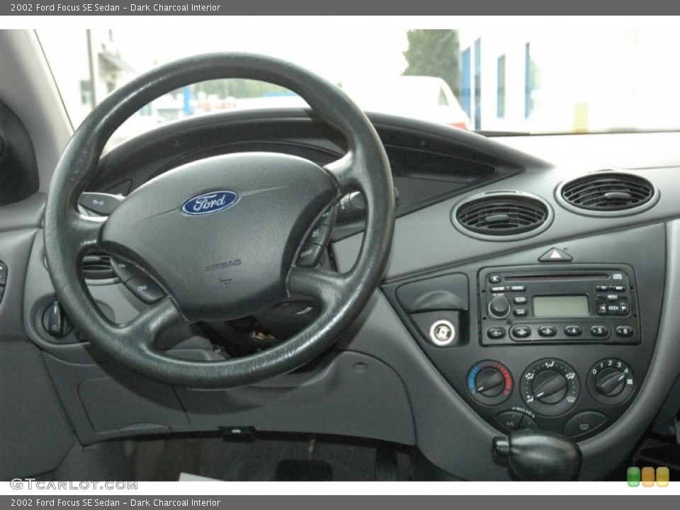 Dark Charcoal Interior Dashboard for the 2002 Ford Focus SE Sedan #54097533