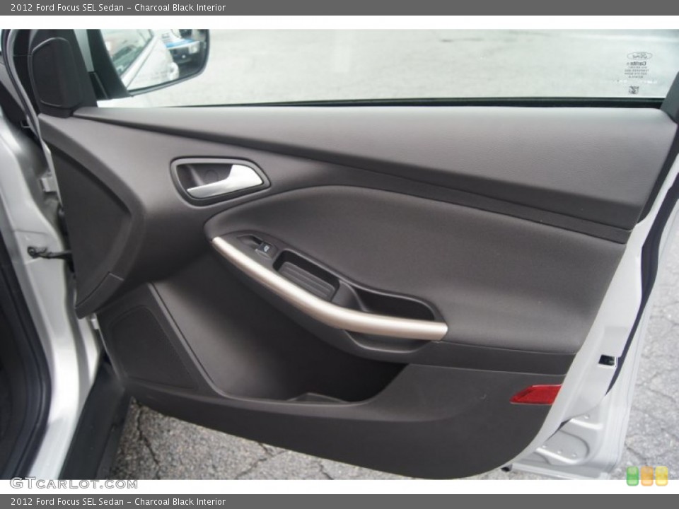 Charcoal Black Interior Door Panel for the 2012 Ford Focus SEL Sedan #54448704