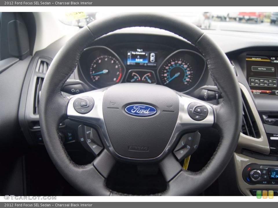 Charcoal Black Interior Steering Wheel for the 2012 Ford Focus SEL Sedan #54448797