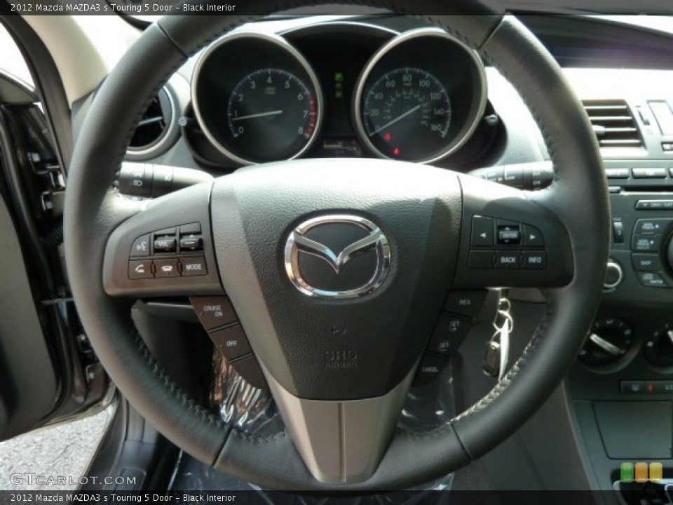 Black Interior Steering Wheel for the 2012 Mazda MAZDA3 s Touring 5 Door #54463188