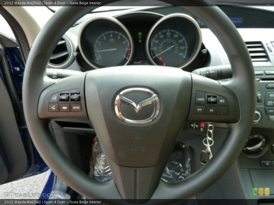 Dune Beige Interior Steering Wheel for the 2012 Mazda MAZDA3 i Sport 4 Door #54463365