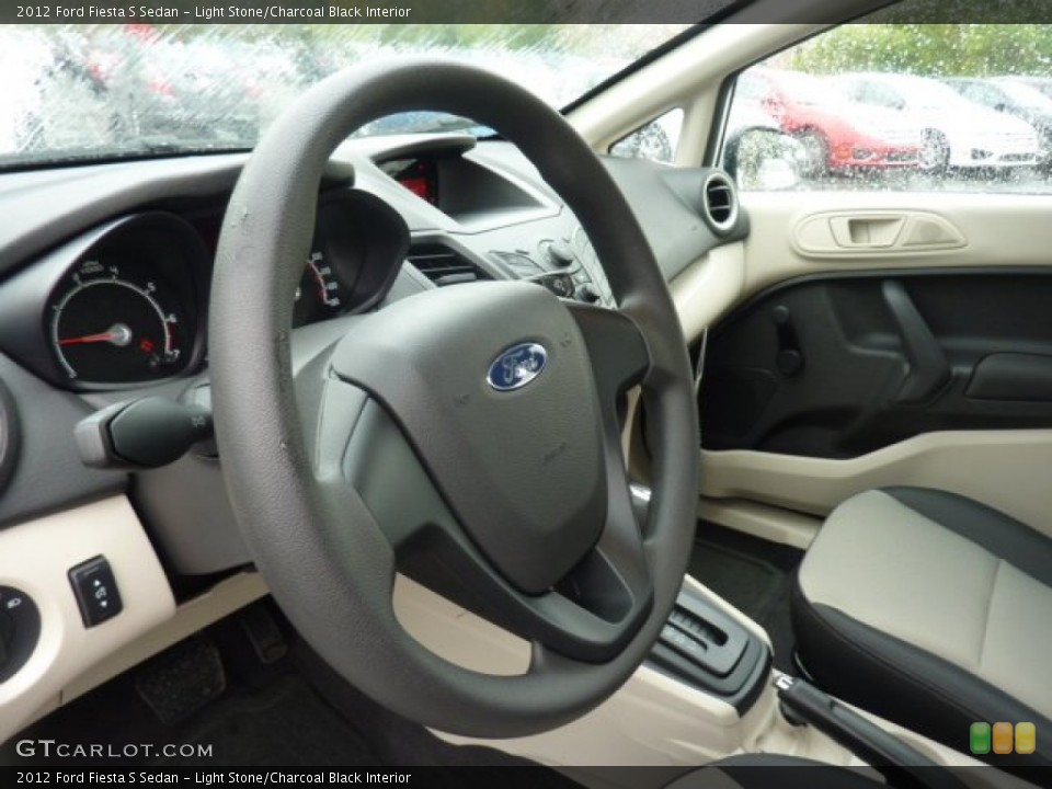 Light Stone/Charcoal Black Interior Steering Wheel for the 2012 Ford Fiesta S Sedan #54517094