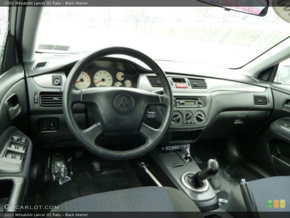 Black Interior Dashboard for the 2003 Mitsubishi Lancer OZ Rally #54531539