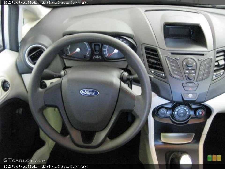 Light Stone/Charcoal Black Interior Steering Wheel for the 2012 Ford Fiesta S Sedan #54535609