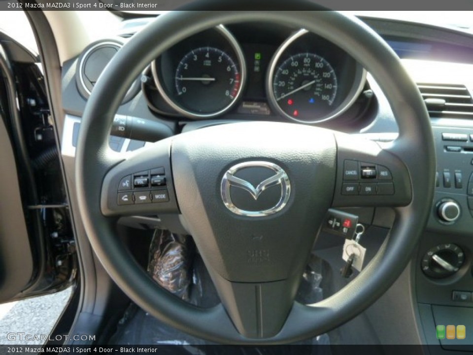 Black Interior Steering Wheel for the 2012 Mazda MAZDA3 i Sport 4 Door #54558981