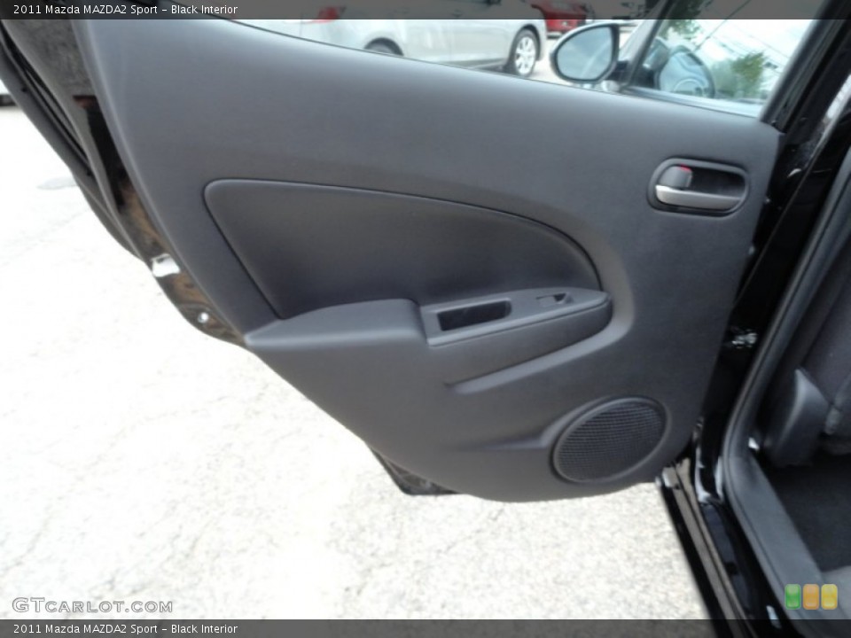 Black Interior Door Panel for the 2011 Mazda MAZDA2 Sport #54564279