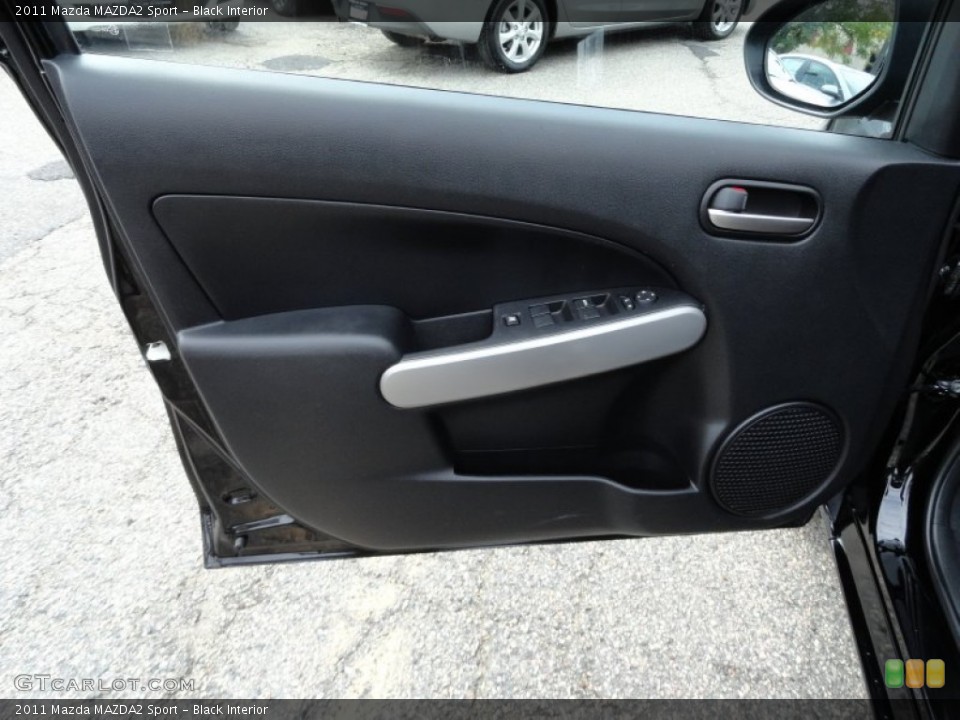 Black Interior Door Panel for the 2011 Mazda MAZDA2 Sport #54564297