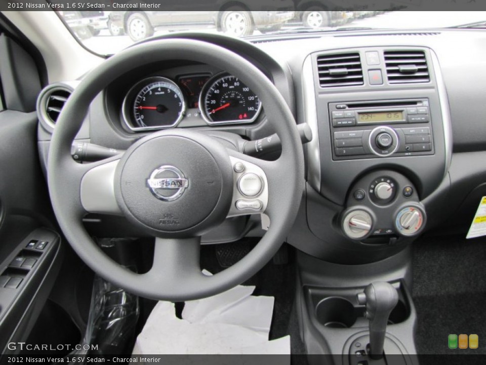 Charcoal Interior Dashboard for the 2012 Nissan Versa 1.6 SV Sedan #54666885