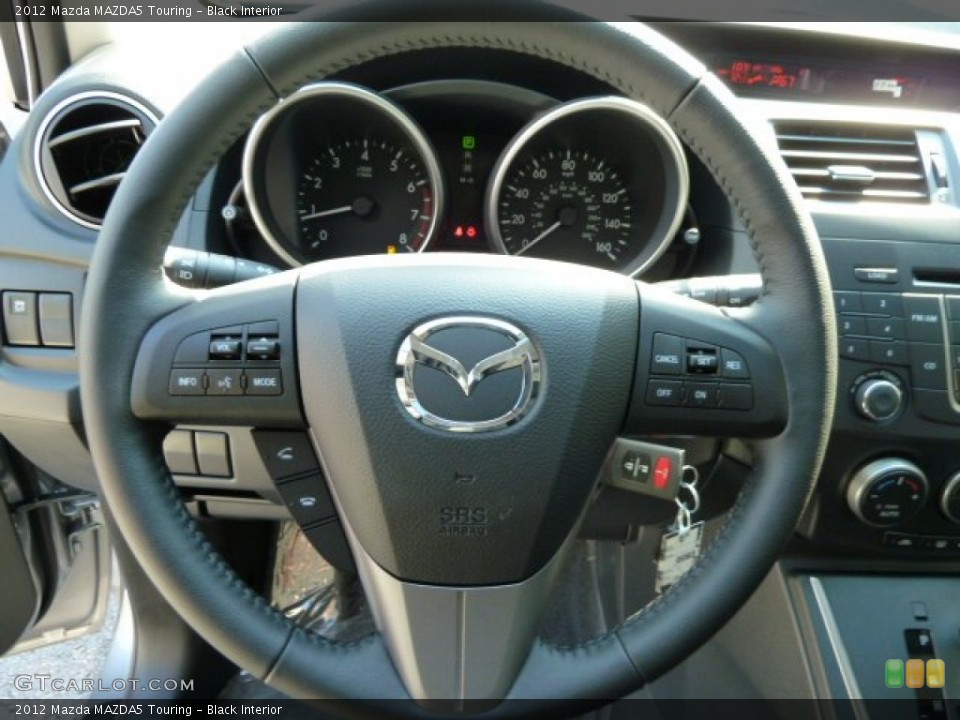 Black Interior Steering Wheel for the 2012 Mazda MAZDA5 Touring #54701941