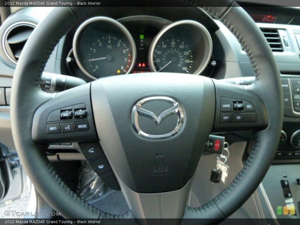 Black Interior Steering Wheel for the 2012 Mazda MAZDA5 Grand Touring #54702481