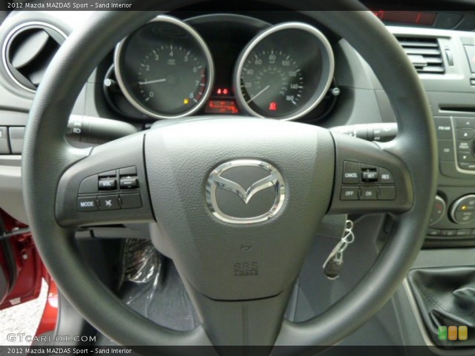 Sand Interior Steering Wheel for the 2012 Mazda MAZDA5 Sport #54703507