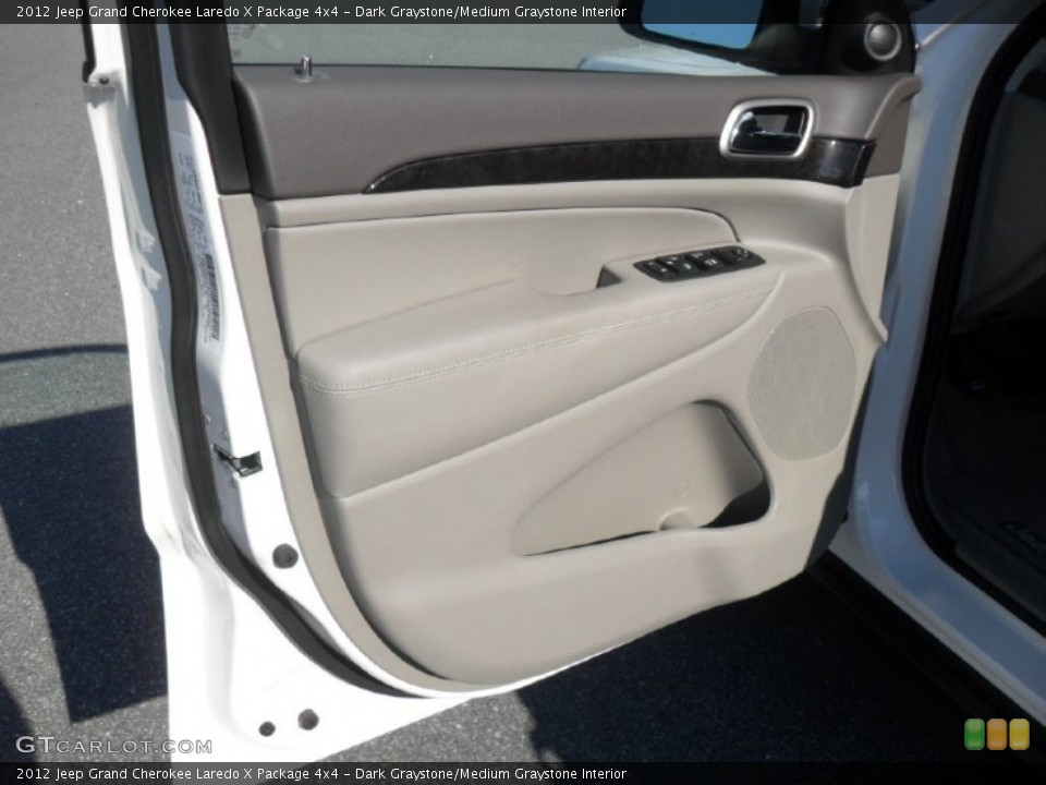 Dark Graystone/Medium Graystone Interior Door Panel for the 2012 Jeep Grand Cherokee Laredo X Package 4x4 #54765790