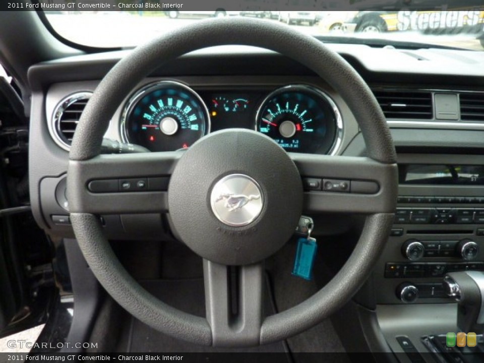 Charcoal Black Interior Steering Wheel for the 2011 Ford Mustang GT Convertible #54772774