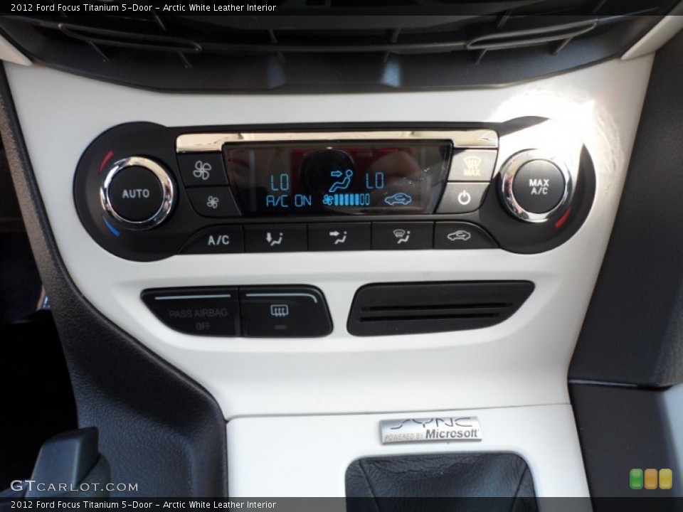 Arctic White Leather Interior Controls for the 2012 Ford Focus Titanium 5-Door #54954816