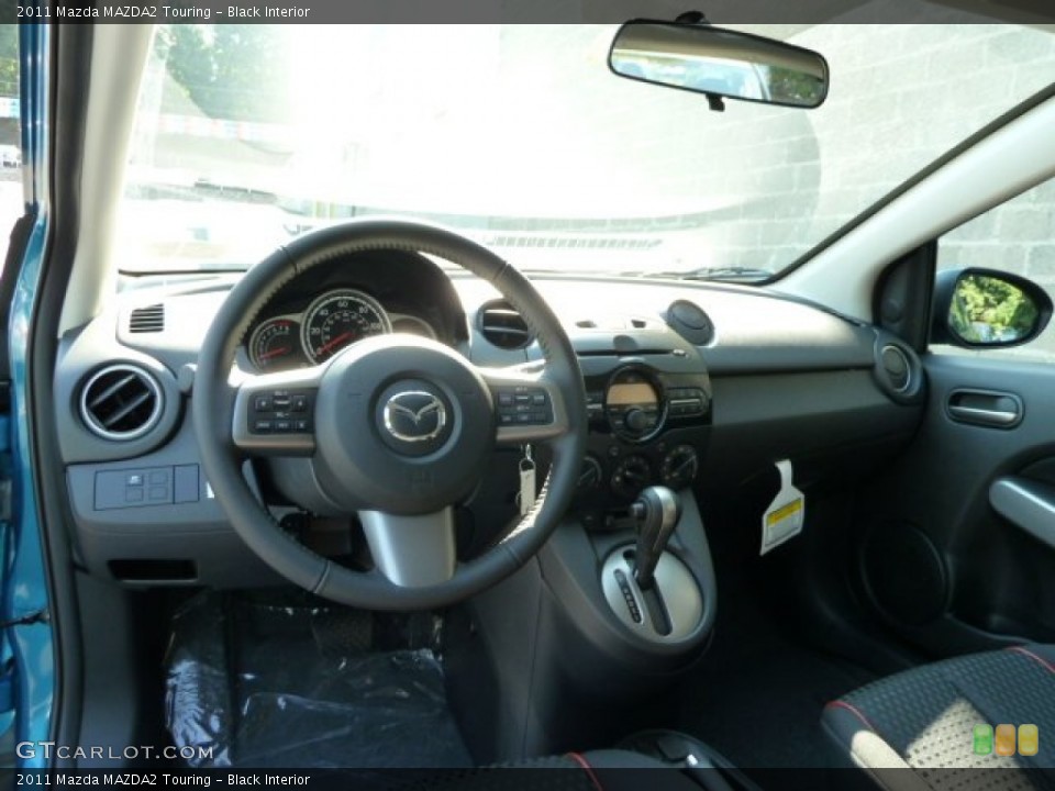 Black Interior Dashboard for the 2011 Mazda MAZDA2 Touring #54975121