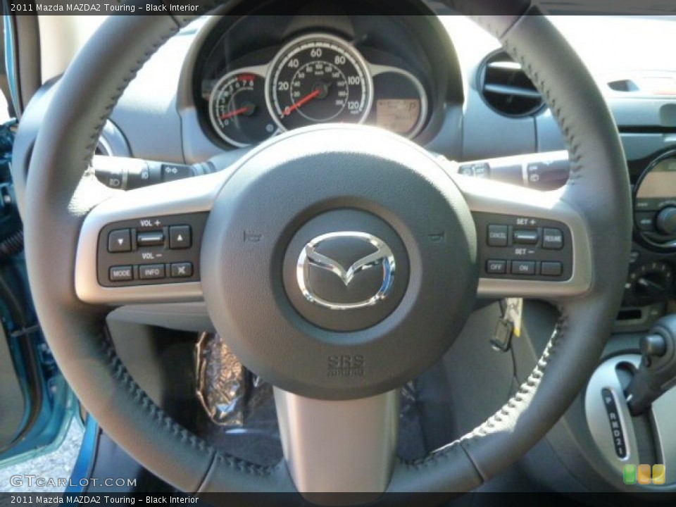 Black Interior Steering Wheel for the 2011 Mazda MAZDA2 Touring #54975157