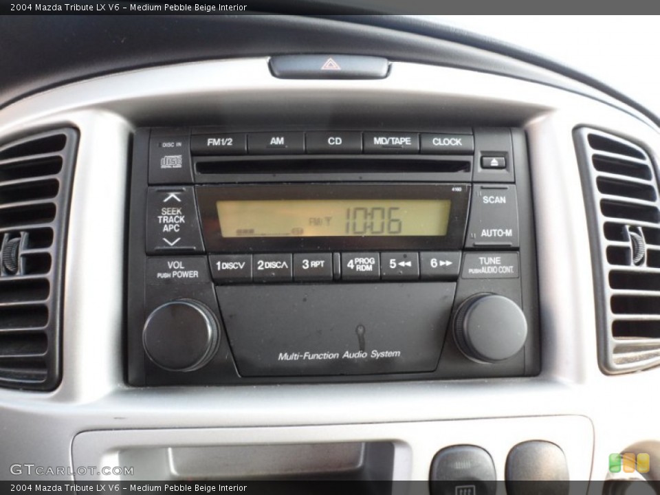 Medium Pebble Beige Interior Audio System for the 2004 Mazda Tribute LX V6 #55003408