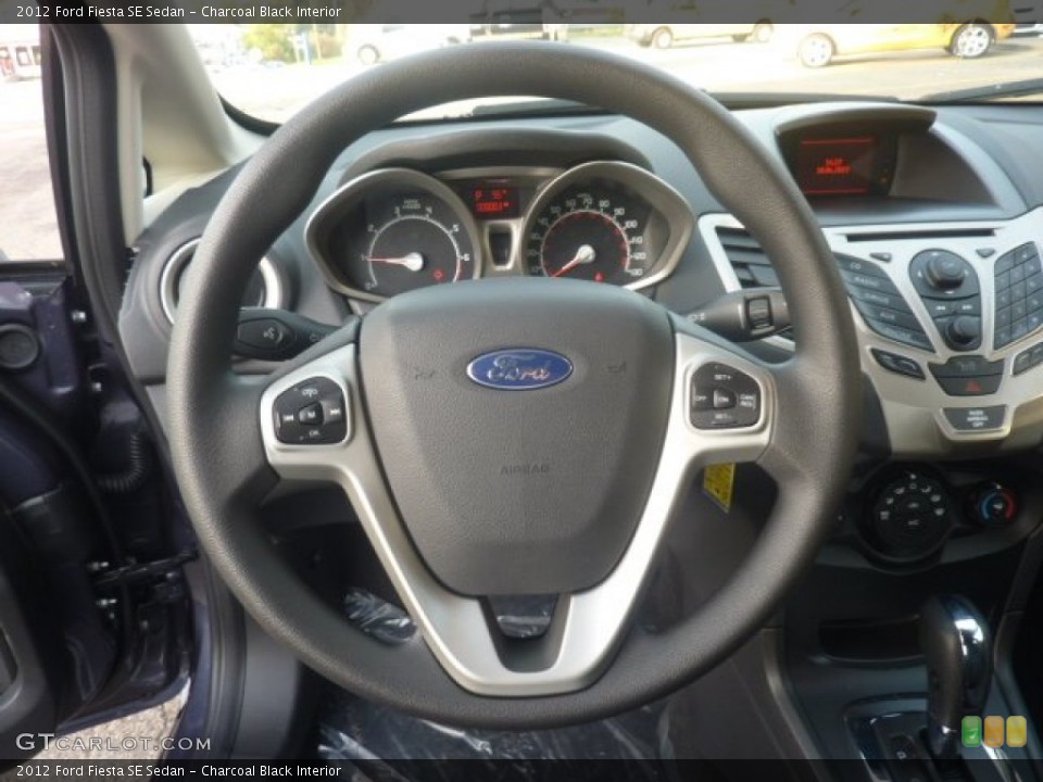 Charcoal Black Interior Steering Wheel for the 2012 Ford Fiesta SE Sedan #55128732