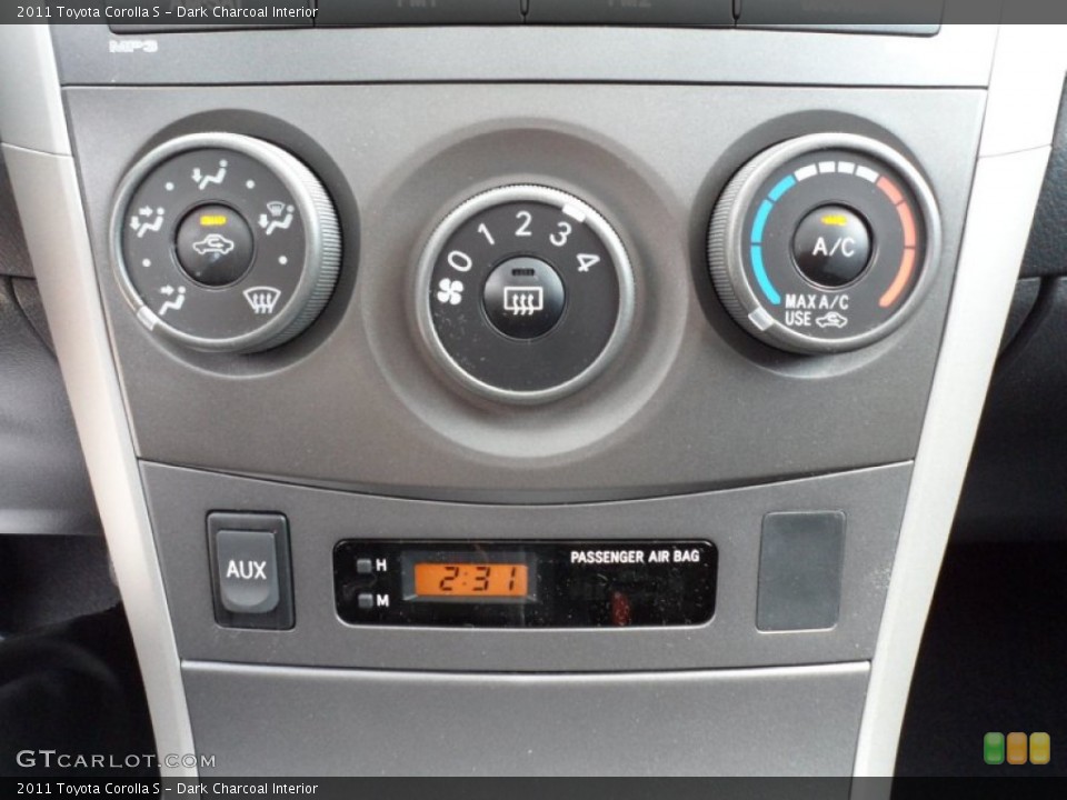 Dark Charcoal Interior Controls for the 2011 Toyota Corolla S #55228210
