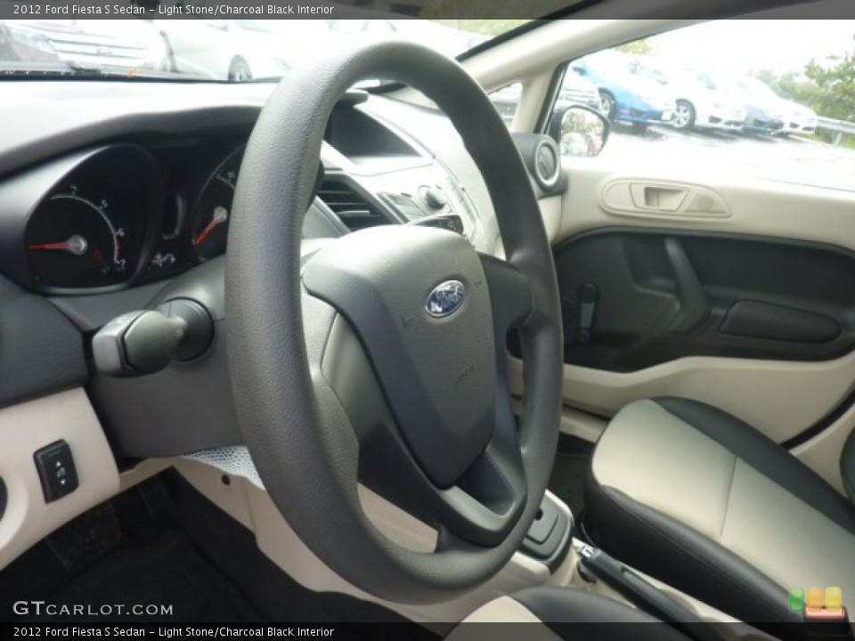 Light Stone/Charcoal Black Interior Steering Wheel for the 2012 Ford Fiesta S Sedan #55538524