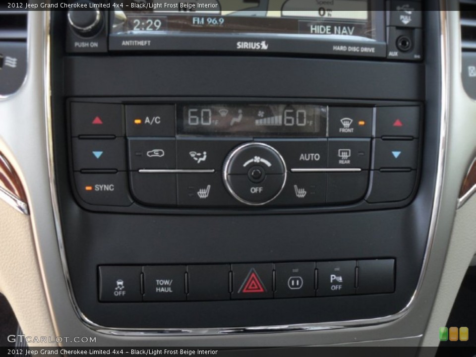 Black/Light Frost Beige Interior Controls for the 2012 Jeep Grand Cherokee Limited 4x4 #55654101