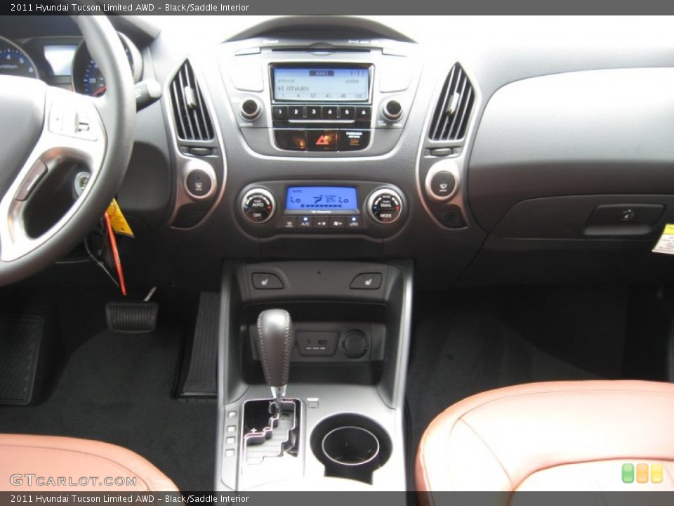 Black/Saddle Interior Controls for the 2011 Hyundai Tucson Limited AWD #55776676
