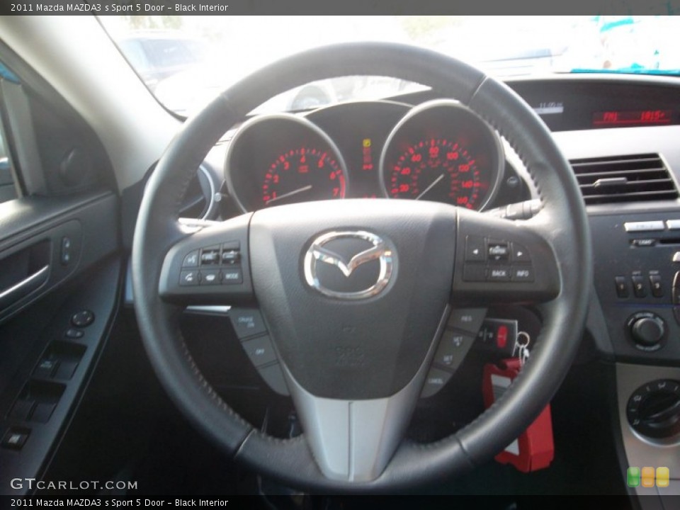 Black Interior Steering Wheel for the 2011 Mazda MAZDA3 s Sport 5 Door #55824980