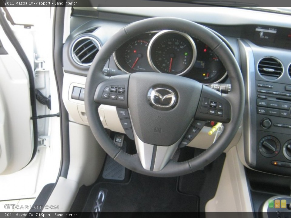 Sand Interior Steering Wheel for the 2011 Mazda CX-7 i Sport #55843970