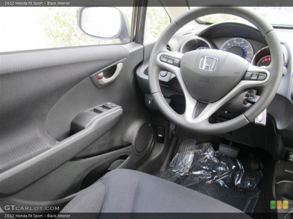 Black Interior Steering Wheel for the 2012 Honda Fit Sport #55853356