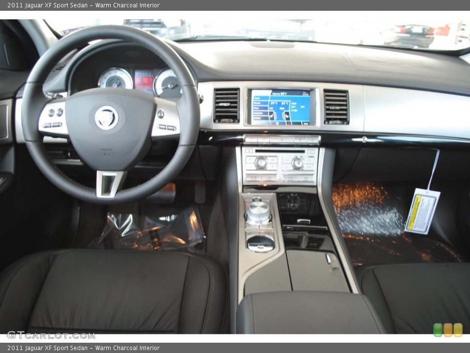 Warm Charcoal Interior Dashboard for the 2011 Jaguar XF Sport Sedan #56068118
