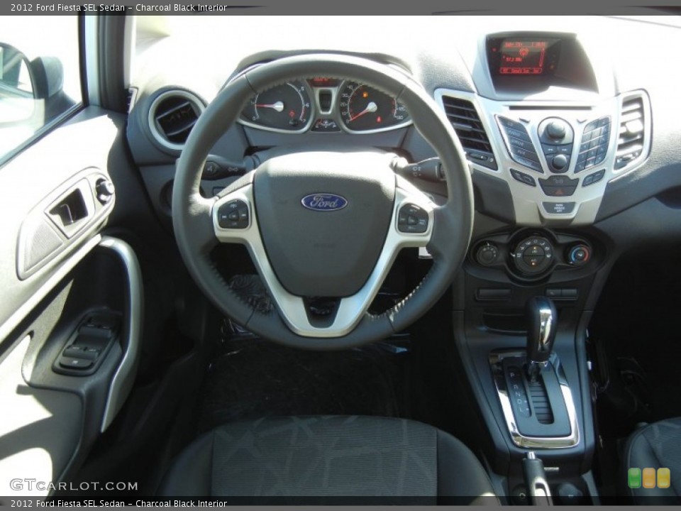 Charcoal Black Interior Dashboard for the 2012 Ford Fiesta SEL Sedan #56125748