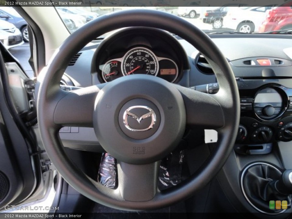 Black Interior Steering Wheel for the 2012 Mazda MAZDA2 Sport #56200925