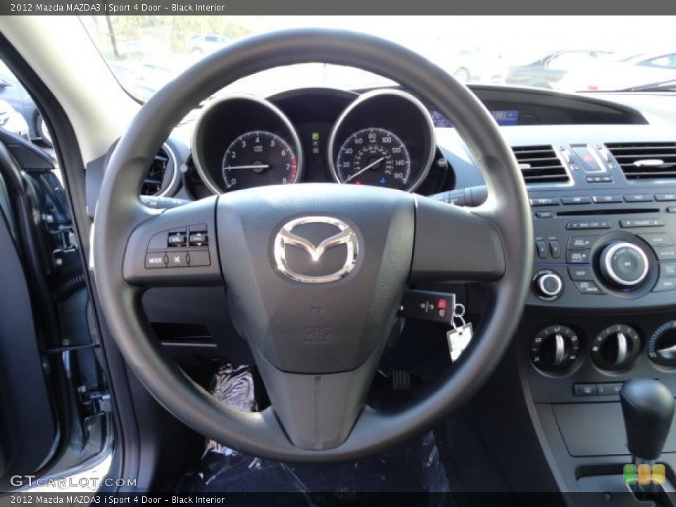 Black Interior Steering Wheel for the 2012 Mazda MAZDA3 i Sport 4 Door #56253914