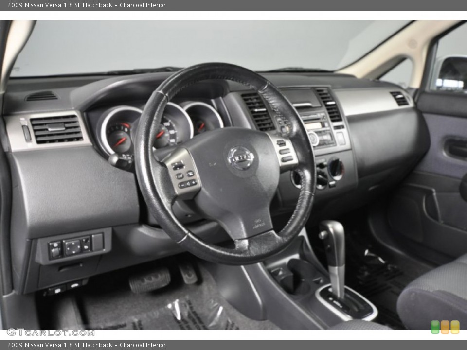 Charcoal Interior Dashboard for the 2009 Nissan Versa 1.8 SL Hatchback #56424628