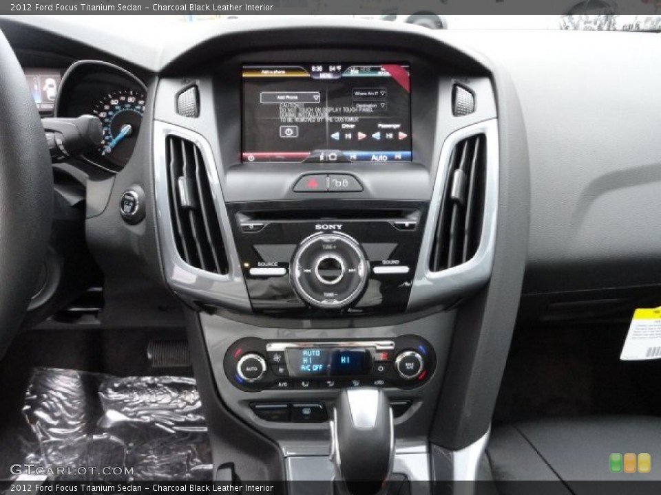 Charcoal Black Leather Interior Controls for the 2012 Ford Focus Titanium Sedan #56590058